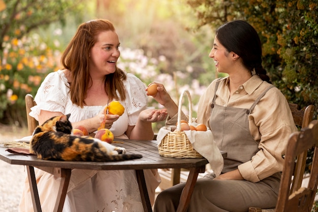 Side view women sitting at table