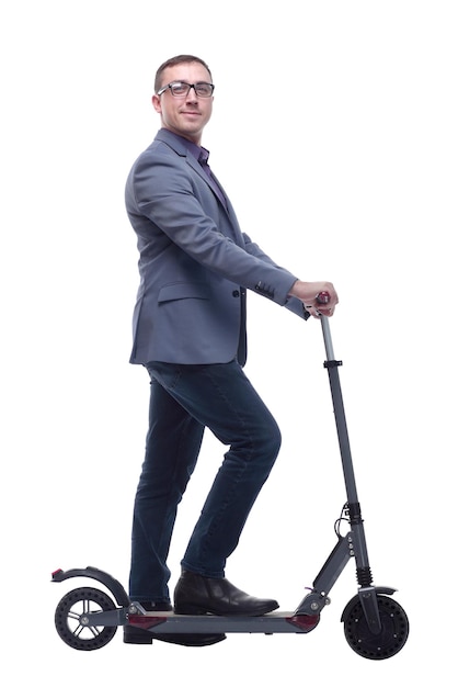 side view of young modern man using and driving electric isolated over white background