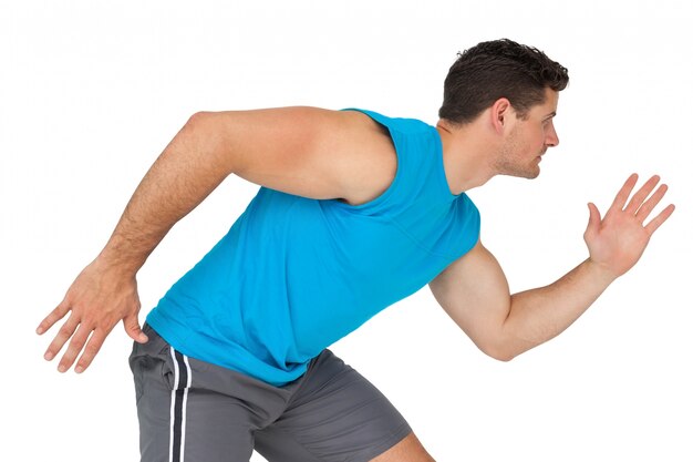 Side view of a young sporty man running