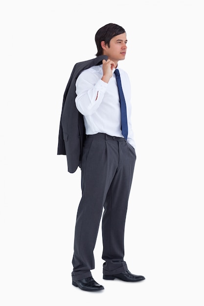 Side view of young tradesman with jacket over his shoulder