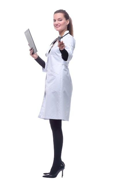 Side view young woman doctor making notes in clipboard