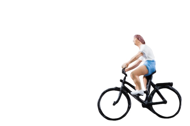 Photo side view of young woman riding bicycle against white background