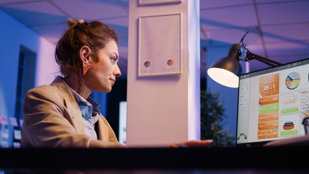 Side view of young woman using mobile phone