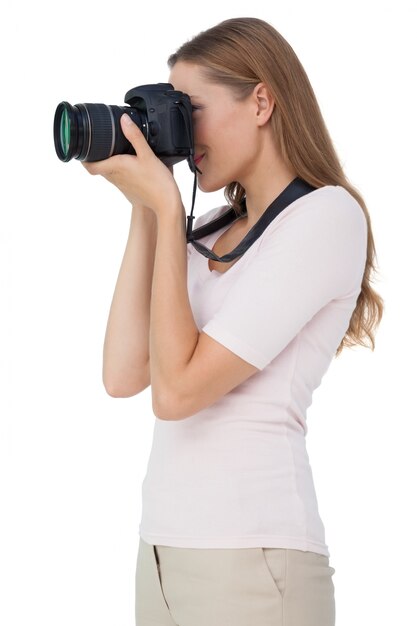 Side view of a young woman with camera