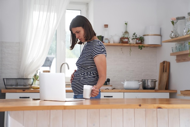 Side view of young woman working at home