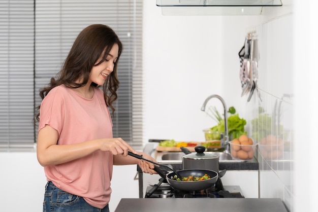 Side view of young woman working at home