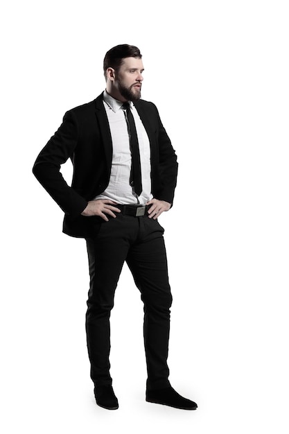 Side viewportrait of a serious businessmanisolated on grey background