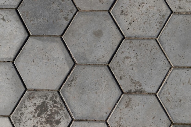 Sidewalk paved with concrete hexagons