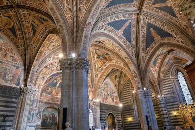 Siena, Italy - June 28, 2018: Panoramic view of interior of Battistero di San Giovanni is a religious building in Siena