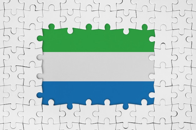 Sierra leone flag in frame of white puzzle pieces with missing central part