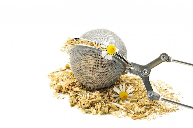 Sieve with dried chamomile isolated on white background