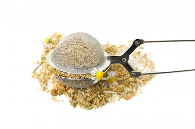 Sieve with dried chamomile isolated on white