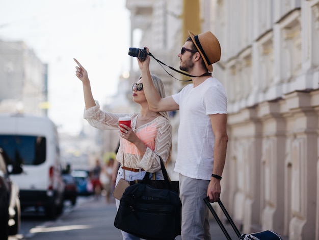 Sightseeing travel. tourists take photos during their holiday. family vacation. beautiful architecture concept