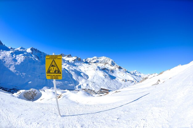 Sign board at high mountains under snow in the winter