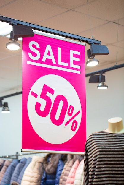 Photo sign in a clothing store with discount inscription