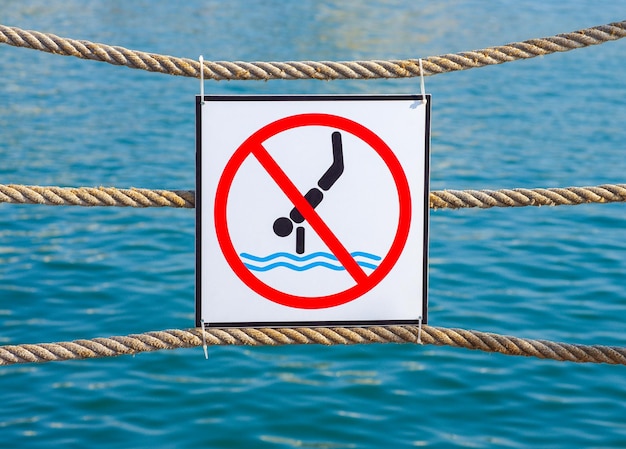 Sign forbidding jumping into the water