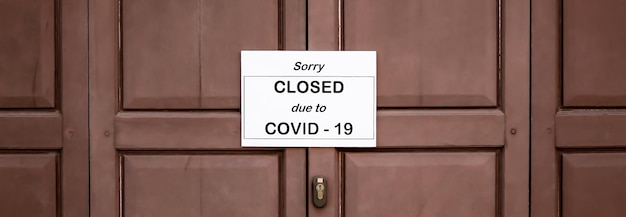 The sign in front of the office is temporarily closed