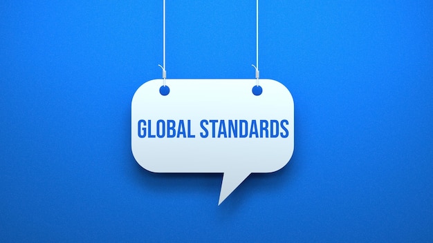 A sign hanging from a string that says global standards