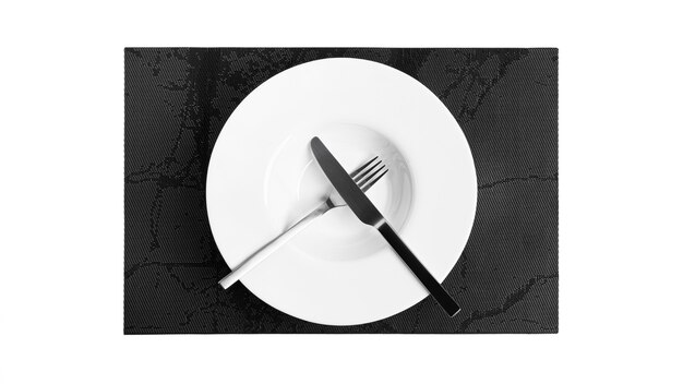 Photo sign language with cutlery. a plate with cutlery isolated on a white background. plate, knife, fork on a white background. high quality photo