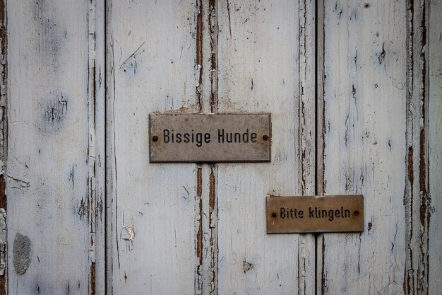 Photo sign on old wooden door