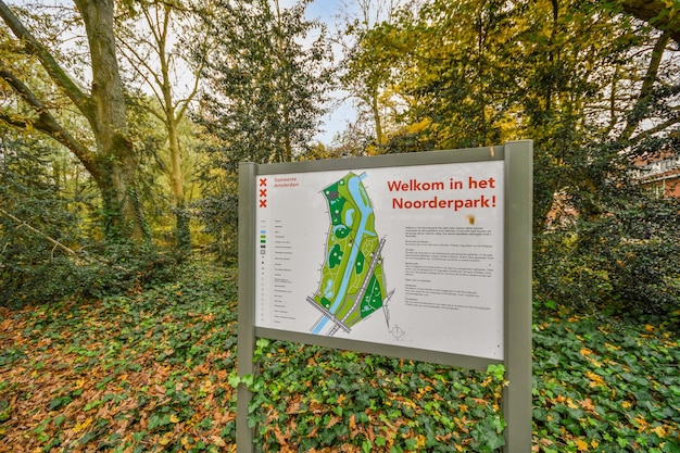 A sign in a park with a map of a