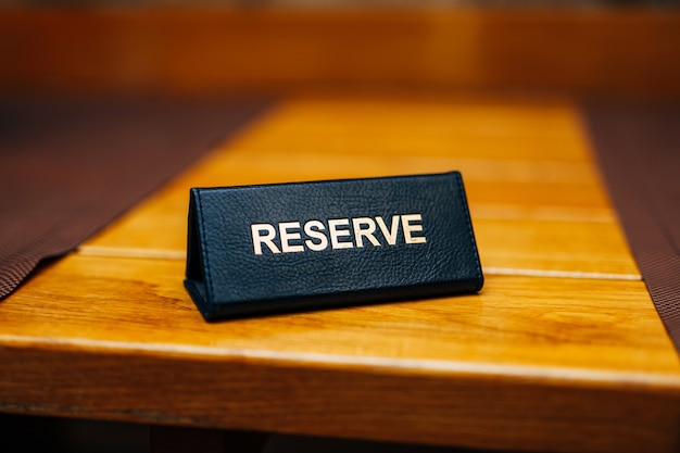 Photo sign reserve on a wooden table in a restaurant