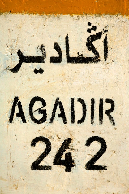 Sign road with distance to agadir