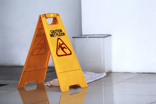 Photo sign showing warning of caution wet floor.wet floor sign.