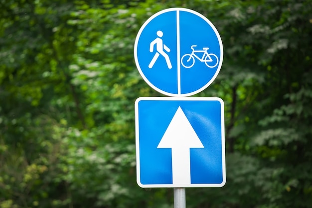 Signs in the park. Road for cyclists. Sports activities.