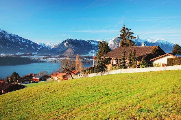 Sigrilwil village and Swiss Alps mountains and Thun lake, Bern canton, Switzerland in winter