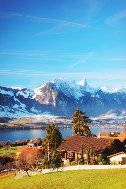 Sigrilwil village with Swiss Alps mountains and Thun lake, Switzerland in winter