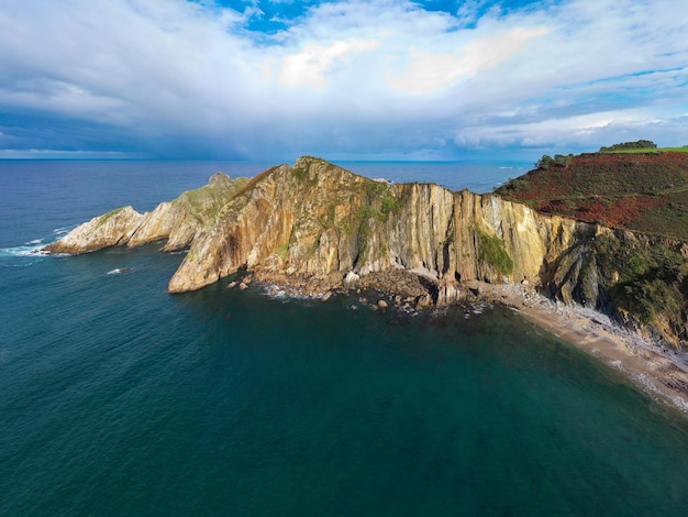 Silence beach silversandy cove backed by a natural rock amphitheatre in Asturias Spain