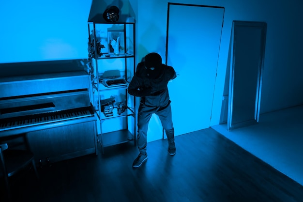 silent thief in a room ready to steal