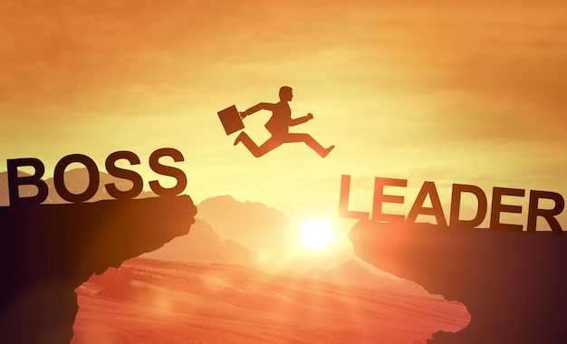 Foto silhouet man springt van baas klif naar leider klif motivatie voor het veranderen van management stijl van baas naar leider leidende manier leiderschapsconcept