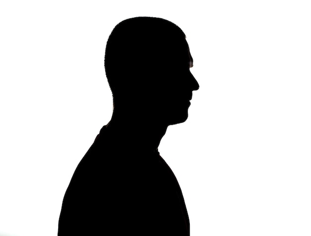 Silhouette of adult man portrait in studio at white background