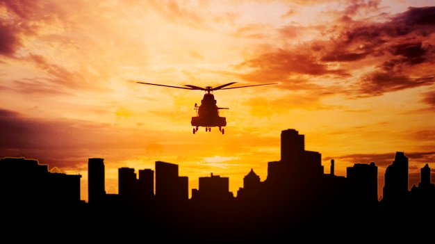 Silhouette of army helicopter hovering over city