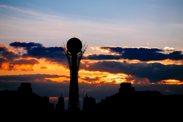 Photo silhouette of astana cityscape capital of kazakhstan on beautiful sunset