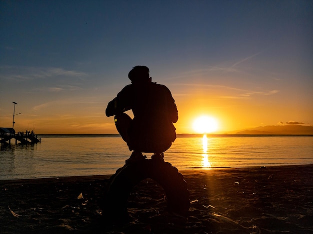 Silhouette on the beach with sunrise
