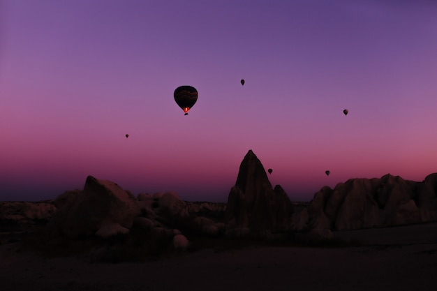 Silhouette of beautiful hot air balloons at sunrise in cappadocia