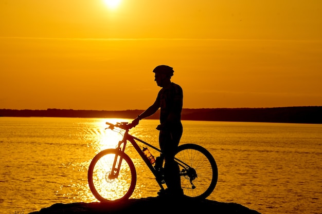 Silhouette of a bike on sky background