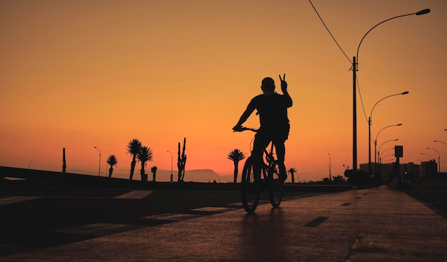 Silhouette bike on sunset and bicycle background Cyclists against the sky at sunset Selective focus