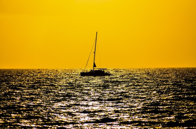 Silhouette boat in the ocean