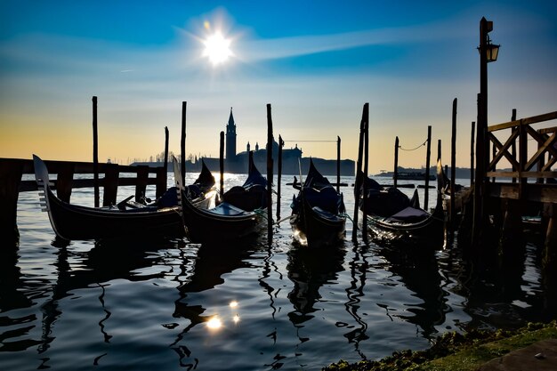 Silhouette of boats moored in water