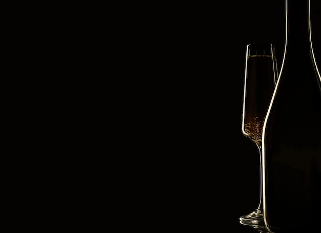 Photo silhouette of bottle and glasses of champagne on black background