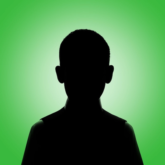 Photo silhouette of a boy boy's avatar boy posing on a green background