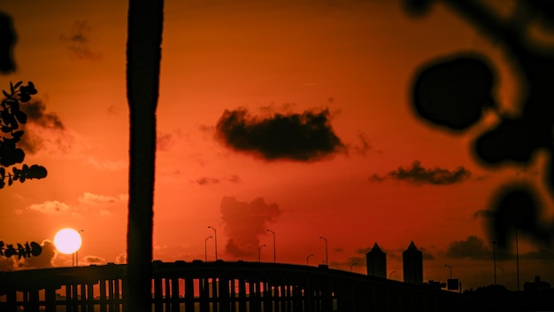 Silhouette bridge against sky during sunset