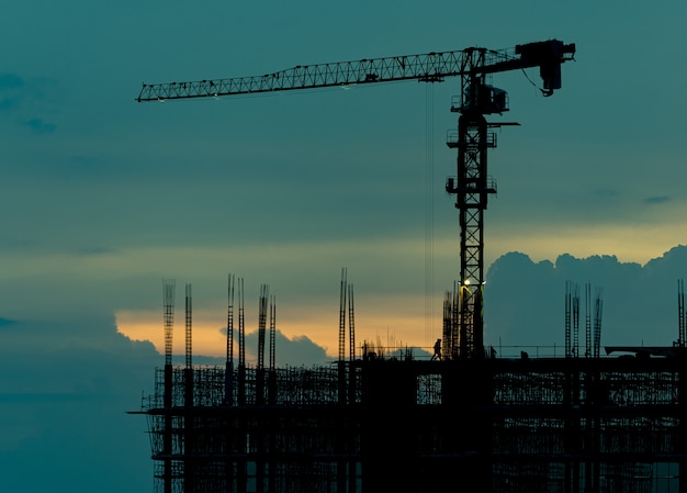 silhouette building, worker, concrete and equipment