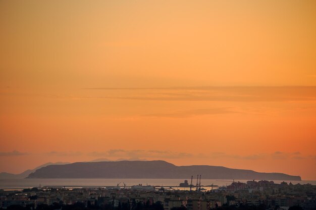 Photo silhouette buildings against sky during sunset