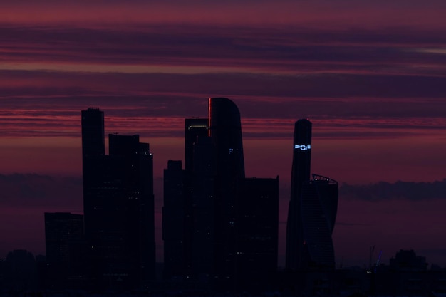 Photo silhouette of buildings at sunset