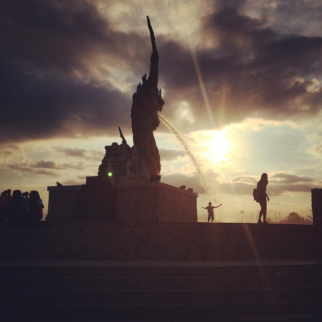 Silhouette built structures at sunset